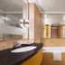 Wanhao International Hotel Benxi bathroom with bathtub, glass shower partition and black vanity