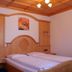 Zu den Linden Nichtraucherhotel room in Aschheim with twin beds and wood-paneled ceiling