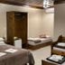 Pousada Charm Canela room in Canela with double bed, twin bed, wardrobe and folded towels