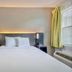 Studio 6 San Antonio, Tx - Medical Center guest room with king bed, window, and bedside lamps