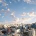 Moxy Seoul Insadong in Seoul with a city skyline and cloudy sky at sunset