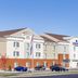 Candlewood Suites Bemidji by IHG exterior with parking lot under clear blue sky