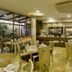 Howard Johnson by Wyndham Barranquilla Versalles dining area with buffet tables and indoor seating in Barranquilla