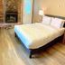 Sunwapta Falls Rocky Mountain Lodge Jasper room with bed, fireplace, desk and TV