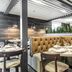 The Burgundy Hotel, Little Rock: upscale restaurant with tufted banquette seating and set dining tables
