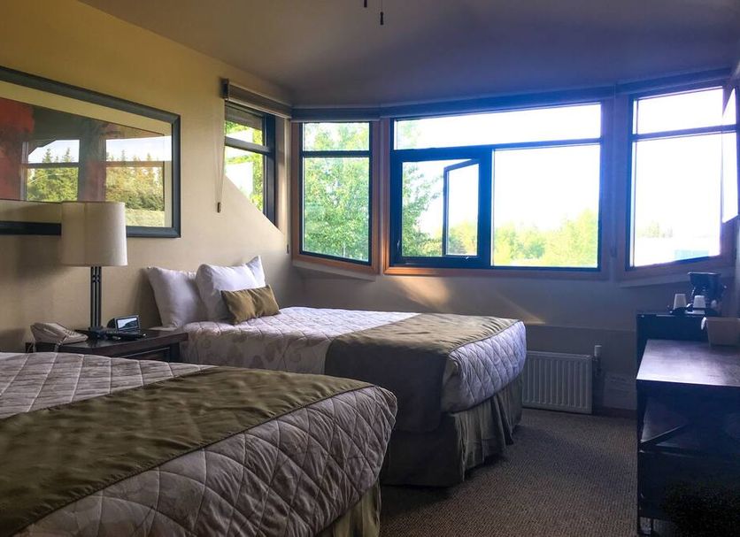 Kenai Airport Hotel in Kenai guest room with two beds and large windows with bright outdoor view