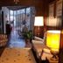La Teresita Hotel Boutique in Salta lobby with striped chairs, lamps, and a glass doorway to the patio