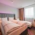 Premier Inn Karlsruhe City Am Wasserturm twin room with large window and curtains in Karlsruhe