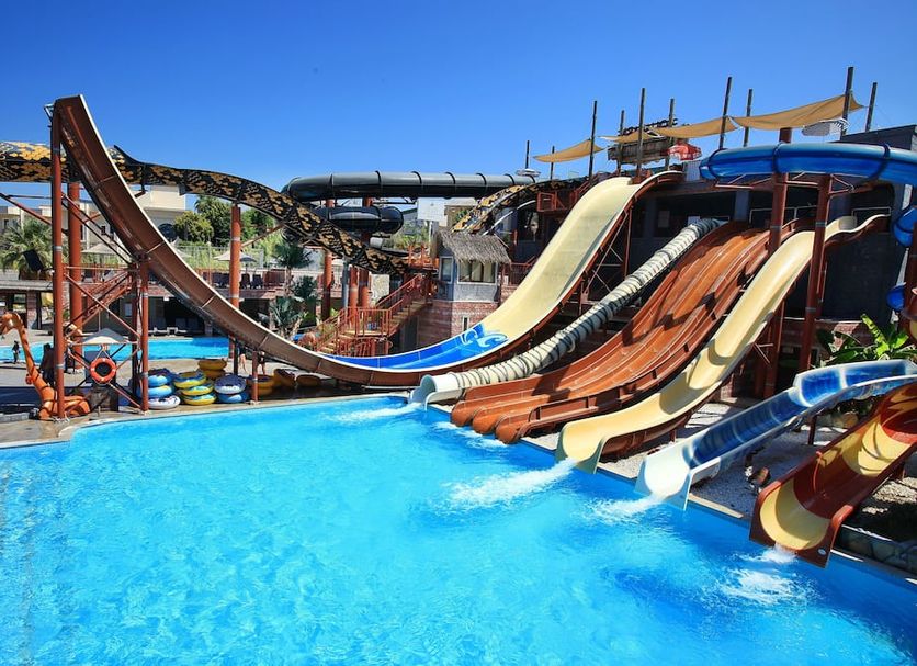 Cactus Fleur Beach Club in Yalikavak, outdoor pool with colorful water slides