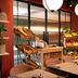 Hyatt Place London City East breakfast area with pastry display and red walls in London