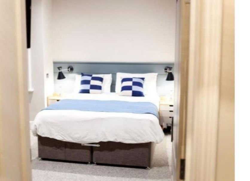 The Bay Hotel Eastbourne guest room with double bed and blue accents