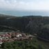 The Sarigerme Inn in Sarigerme overlooking coastline, hills, and a village with red-roofed buildings