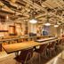 ONE@Tokyo by insomnia Tokyo lobby lounge with long communal tables and exposed industrial ceiling