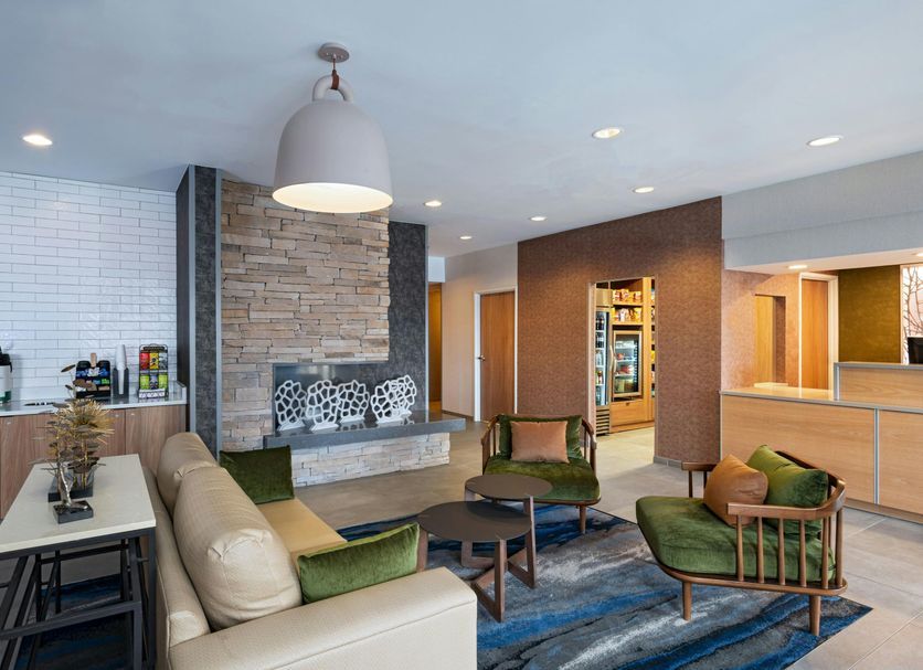 Fairfield by Marriott Inn & Suites Kansas City Airport lobby seating area in Kansas City