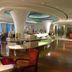 The Purple Palace Nanjing lobby lounge with curved ceiling, buffet counter, and city-view windows