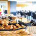 Breakfast buffet at La Confiance in Le Mont-Saint-Michel with baskets of pastries and bread