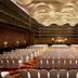 JW Marriott Hotel Bengaluru meeting ballroom with rows of white chairs and ornate ceiling