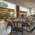 Yogi Executive, Navi Mumbai restaurant with modern dining area and large windows overlooking greenery