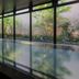 Jr Kyushu Hotel Kumamoto indoor pool with floor-to-ceiling windows and garden views in Kumamoto