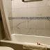 Triplodge of Santa Clarita bathroom with bathtub and shower curtain in Forest Park