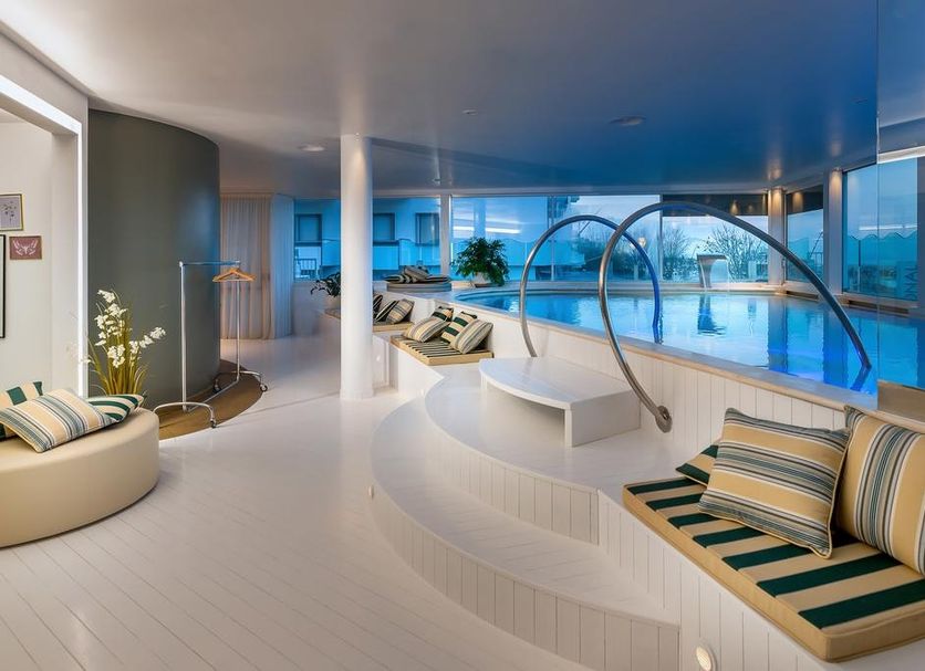 Savoia Hotel Rimini spa with indoor pool, lounge seating and sea views in Rimini