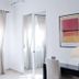 La Corte degli Spada - Borgo Antico del Salento room with sheer curtains, mirrored wardrobe and desk in Mesagne