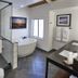 Grand Geneva Resort & Spa in Lake Geneva bathroom with glass shower, soaking tub and modern tiled floor