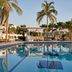 Juweira Boutique Hotel - Adults only in Salalah, palm-lined pool with waterfront reflections