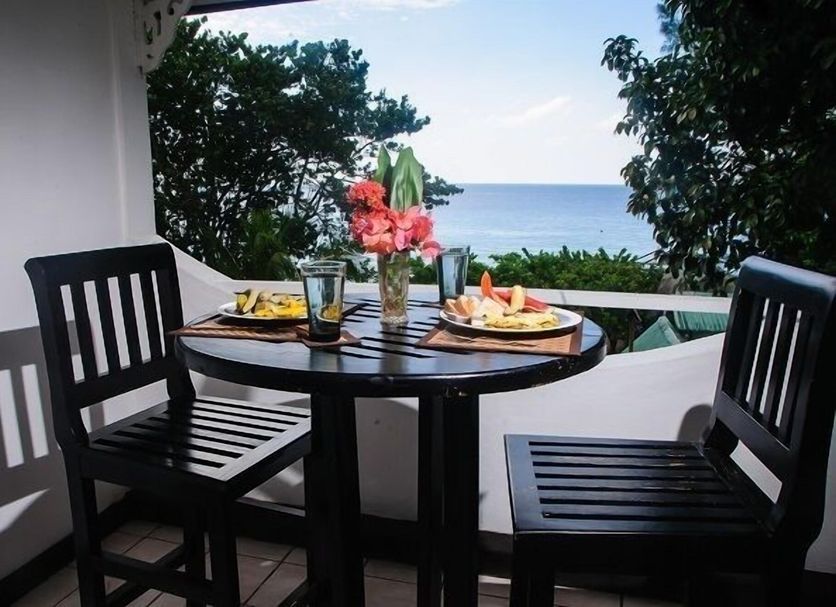 Firefly Beach Cottages and Suites in Negril balcony table with ocean view