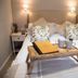 The Family Tree, Matlock: cozy double bed with breakfast tray in a softly lit guest room