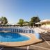 htop Molinos Park in Salou features an outdoor pool with sun loungers and umbrellas under a clear sky.