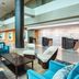 The Westin Southfield Detroit lobby with seating area and front desk in Southfield