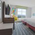 Hampton Inn Santa Clarita-Valencia guest room with two beds and a window view of Santa Clarita