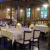 Landhotel Burkartsmühle in Hofheim dining room with set tables, bookshelves, and warm lighting