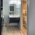 Studio 6 Vicksburg, MS guest room vanity, mirror, and open bathroom doorway