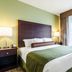 Cobblestone Hotel & Suites - Mccook guest room with king bed and large window in McCook