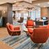 Fairfield Inn and Suites by Marriott Raleigh Cary lobby lounge with colorful chairs and seating area