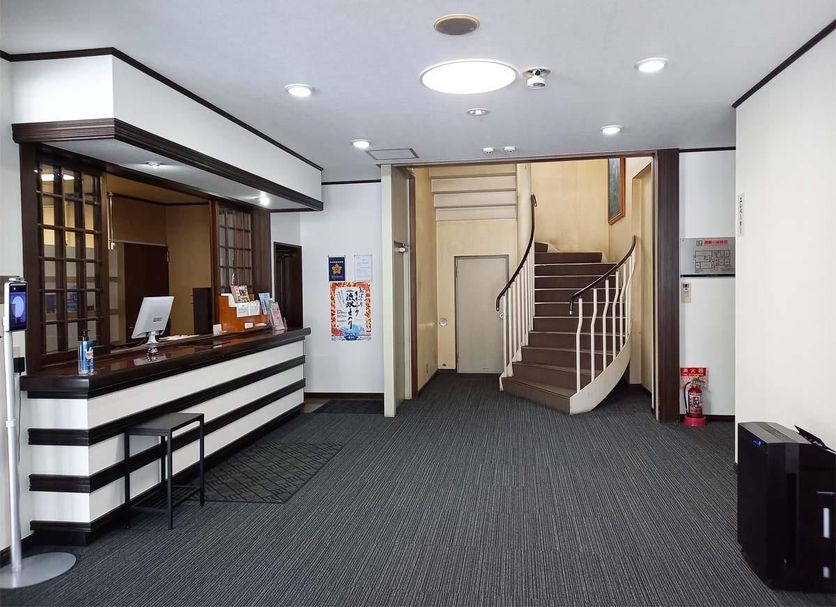 Hotel Sun Abashiri lobby with front desk and staircase in Abashiri