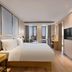Echarm Hotel Chongqing West Railway Station guest room with city view and large bed