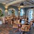 Fletcher Hotel-Restaurant La Ville Blanche in Thorn dining room with round tables and arched blue walls