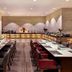 Grand Mercure Jakarta Harmoni restaurant dining room with buffet and set tables in Jakarta