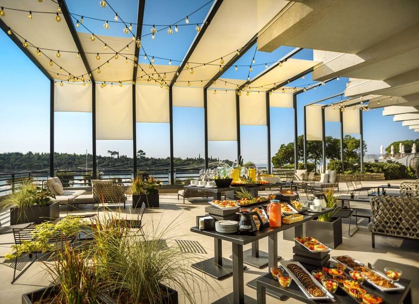 Maistra Select All Suite Island Hotel Istra rooftop terrace dining with sea views in Rovinj