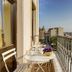 Galata Antique Hotel in Istanbul balcony with small table, chairs, and city skyline view