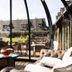 Les Manoirs de Tourgéville in Deauville lounge with curved glass walls and garden view