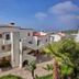 Real del Mar Golf Resort in Tijuana with white resort buildings, palm trees, and hillside views