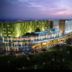 Swiss-Belhotel Airport Jakarta in Tangerang City, exterior view with illuminated modern facade at dusk
