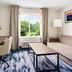 Fairfield Inn & Suites by Marriott Harrisburg Hershey room with sofa, desk and window view