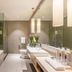 Ziction Liberal Hotel Xi'an bathroom with soaking tub, glass shower, double vanity and toilet