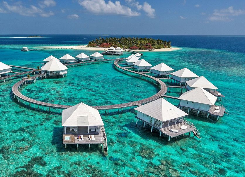 Diamonds Thudufushi Beach & Water Villas in Thudufushi with overwater villas and turquoise lagoon