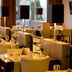 Van Der Valk Hotel Ara in Zwijndrecht restaurant with set dining tables and large windows